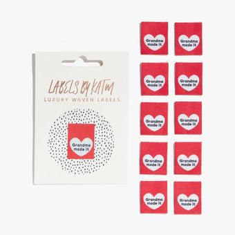 woven sew in labels by KATM red with white heart reads "grandma made it"