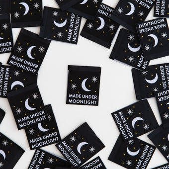 black woven sew-in labels with metallic silver moon and "made under moonlight" text. By Sarah Hearts.