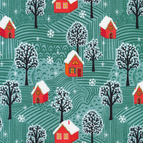 organic cotton fabric with green background of snowy forest and red cabins