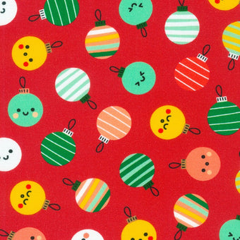 red cotton fabric with multi color glass bulb ornaments with smiley faces